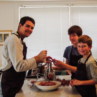 Stuart, #1 and #3 stepson and our original $40 meat grinder. It seems so small now.